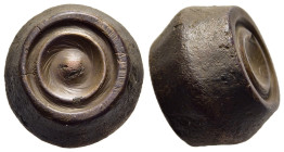 ISLAMIC WEIGHTS (circa 10-13th centuries). Commercial weight of uncertain standard. Bronze.

A barrel shaped Seljuk or Beylik coin or commercial weigh...