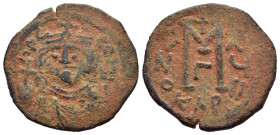 ISLAMIC. Umayyads. Arab- Byzantine types. AE Fals (AD 650s-670s). Mint name KAP, derived from Carthago.

Obv: Imperial bust facing, holding globus cru...