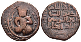 ISLAMIC. Artuqids (Mardin). Nasir al-Din Artuq Arslan. AH 597-637 / AD 1200-1239. Æ Dirham.

Obv: Male figure seated facing with legs crossed, resting...