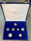 Olympische Spiele. 
Sonstiges. 
Kassette mit 7 Münzen der Olympischen Spiele 1952 - 1972: Finnland 500 Markaa 1952H, Österreich 2x 50 Schilling 1964...