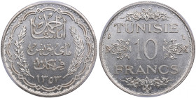 Tunisia 10 Francs AH1353 (1934) - PCGS MS64
The highest graded in PCGS census (1/0). Splendid lustrous specimen. Lec 327.