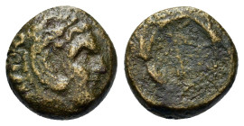 Macedon, Uncertain mint. Æ (13,2mm, 3.1g). Head of Herakles r. R/ Club(?) within wreath.
