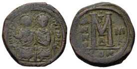 Justin II and Sophia (565-578). Æ 40 Nummi (29mm, 16g) Constantinople.Nimbate figures of Justin and Sophia seated facing on double throne, holding glo...