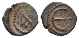 Justin II (565-578). Æ 5 Nummi (15mm, 1.73g, 6h). Constantinople. Monogram. R/ Large Є; [letter] to r. Sear 363. Brown patina, near VF