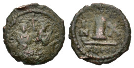 Justin II (565-578). Æ 10 Nummi (18,5mm, 3g). Theoupolis (Antioch), year 10 (574/5). Justin and Sophia enthroned facing, holding cross on globe betwee...