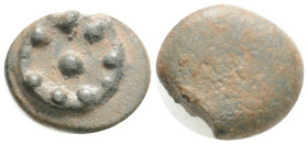Greek-Roman Tessera (1st century BC - 1st century AD). Ae.
Obv: Fibula.
Rev: Blank.
 5.4 Gr. 17.5 mm