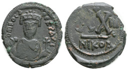 PHOCAS (602-610). Follis. Nicomedia. Dated RY 3 (607/8). 6,9 g. 25,7 mm.
Obv: D N FOCAS ERPAV (S). Crowned bust facing, wearing consular robes and ho...