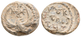 Byzantine Pb Seal, c. 7th-12th century (21,1 mm, 14,37 g, ). Eagle standing facing, head r., with wings spread; cruciform monogram above. R/ Legend in...
