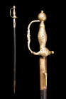 A BAROQUE FRENCH SMALL SWORD GILT BRONZE WITH SCABBARD

 Ca. 18th century AD
 A small sword, a symbol of elegance and sophistication during the 18t...