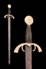 A SWORD IN 15TH CENTURY STYLE

 Ca. 19th-20th century AD
 A fine sword executed in a 15th-century style features a broad blade, tapering to a sharp...