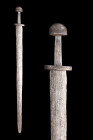 MEDIEVAL VIKING IRON SWORD

 Ca. 900-1000 AD
 An iron sword In excavated condition, with a broad double-edged blade, the hilt comprising thick ovoi...