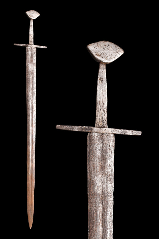 NORMAN IRON BRAZIL-NUT POMMEL SWORD

 Ca. 1000-1100 AD
 An iron sword with a ...