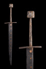 MEDIEVAL IRON DAGGER WITH SQUARE POMMEL

 Ca. 1300 AD
 An iron dagger with a slender cross-shaped hand guard and a square pommel. The narrow taperi...