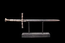 MEDIEVAL IRON DAGGER / STILETTO

 Ca. 1400-1500 AD
 A Medieval dagger/stiletto with a long thin blade and handle. The cross guard is a square secti...