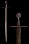 LATE VIKING / NORMAN SWORD WITH CIRCULAR POMMEL

 Ca. 1025-1380 AD
 A stunning iron sword Oakshott type ‘G’, with a wide blade almost parallel, the...
