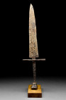 SHORT MEDIEVAL DAGGER WITH SCENT BOTTLE SHAPED POMMEL

 Ca. 13th-15th century AD
 A short iron dagger with a broad blade tapering to a point. The c...