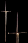 LATE MEDIEVAL SWORD WITH LONG THIN, ‘TOMMY BAR’ TYPE CROSS GUARD

 Ca. 1425-1450 AD
 An excellent forged-iron long sword with a broad blade taperin...