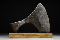 VIKING IRON "DANISH AXE HEAD" DANISH AXE

 Ca. 1000-1100 AD
 The broad blade flaring to the curved cutting edge, with an eared socket with a D-shap...