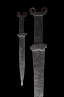 SCYTHIAN IRON ACINACES SWORD

 Ca. 500-400 BC
 An iron sword with a broad tapering blade, which terminates in a point, rectangular grip with a lobe...