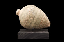 BYZANTINE POTTERY "GREEK FIRE" GRENADE

 Ca. 800-1000 AD
 A ceramic grenade also referred to as 'Greek Fire'. This hollow ceramic vessel consists o...