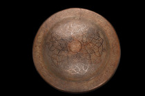 LARGE BRONZE DOORKNOB

 Safavid / Mughal, 1604 AD
 A doorknob plate featuring a domed shape that is both imposing and elegant, with a flat flange t...