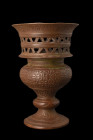 ISLAMIC INCENSE BURNER

 Ca. 17th-19th century AD
 An incense burner with its balustered body and splayed circular foot exudes an aura of opulence ...