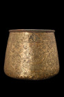 TIMURID BRASS POT

 Ca. 14th century AD
 A brass vessel featuring a round base with walls that gently taper to the opening, which is adorned with a...