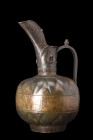 SELJUK EWER

 Ca. 1100-1200 AD
 This Seljuk brass ewer is a remarkable piece of craftsmanship, adorned with intricate details that attest to the ar...