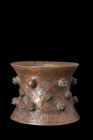 KHORASAN BRONZE DECORATED MORTAR

 Ca. 1100-1200 AD
 A spool-shaped mortar flares gracefully at both the bottom and upper edge, creating an impress...