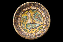 NISHAPUR POTTERY BOWL WITH PEACOCK

 Ca. 900-1000 AD
 A lovely bowl, with its flaring form and inward-curving lip. The bowl's interior is adorned w...