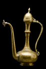 QAJAR BRASS EWER

 Ca. 18th century AD
 A beautiful brass ewer of typical piriform shape with an S-shaped handle, and a long spout. The vessel rise...