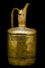 BRASS EWER WITH BORAQ AND EASTERN KUFIC SCRIPT

 Ca. 12th century AD
 A cylindrical brass ewer with a handle, and a prominent spout coming out from...