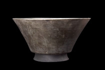 ISLAMIC BOWL WITH CALLIGRAPHY

 Seljuk, Ca. 1200 AD
 A deep bowl boasting a truncated cone profile that gracefully rests on a concave foot, while t...