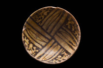 NISHAPUR SLIPWARE BOWL

 Ca. Late 8th - early 9th century AD
 A pottery bowl with a deep round basin and unglazed short foot. Decor in dark brown o...
