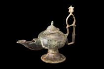 SELJUK BRONZE OIL LAMP

 Ca. 1100-1200 AD
 A bronze oil lamp with its form both functional and aesthetically pleasing, featuring a flaring, concave...