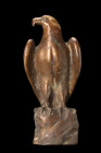 ISLAMIC BRASS EAGLE STATUETTE

 Ca. 17th-19th century AD
 A brass sculpture of an eagle, gracefully perched atop an irregularly shaped base. This r...