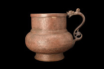 TIMURID BRASS DRAGON HANDLED EWER

 Ca. 15th century AD
 A brass ewer with its exquisite dragon handle. This masterful piece features a squat, glob...