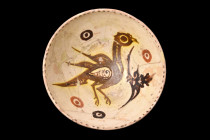 NISHAPUR POTTERY GLAZED BOWL WITH A BIRD

 Ca. 1000-1100 AD
 A pottery bowl of a hemispherical form resting on a low ring foot with the interior fe...