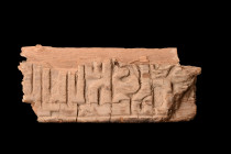 WOOD FRAGMENT WITH INSCRIPTION

 Mamluk ca. 1250-1517 AD or later
 A wooden fragment of a rectangular shape and an intricately carved one-line insc...