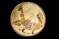 NISHAPUR POTTERY BOWL WITH A BIRD

 Ca. 900-1000 AD
 The graceful conical form of the bowl is accentuated by the subtle inward curve of the lip, le...