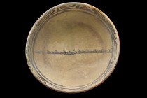 SAMANID POTTERY BOWL WITH INSCRIPTION

 Ca. 900-1000 AD
 A ceramic bowl with flaring walls rising from a short circular foot. The deep interior is ...