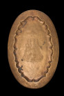 INDIAN BRASS OVAL-SHAPED TRAY

 Deccan, ca. 16th-18th century AD
 A brass oval-shaped tray with a beautifully shaped recess and flat rim. The sunke...