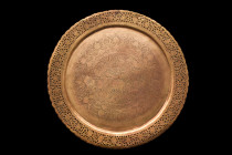 ISLAMIC BRASS DECORATED TRAY

 Ca. 17th-19th century AD
 A circular tray with an openwork flange rendered with precision adds an air of elegance an...
