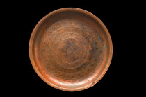 ISLAMIC DECORATED TRAY

 Ca. 17th-19th century AD
 A circular tray with a low ring base and intricate arabesque designs around the inside of the ba...
