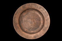 ISLAMIC DECORATED PLATE

 Ca. 17th-19th century AD
 A plate of circular form with a flat base and flaring rim is adorned with a fine calligraphic b...