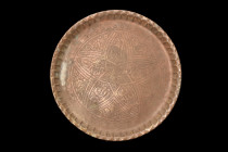 ISLAMIC DECORATED PLATE

 Ca. 17th-19th century AD
 A circular tray with a flat base and a raised rim that has been expertly chiseled to create a m...