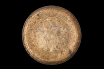 ISLAMIC DECORATED SHALLOW PLATE

 Ca. 17th-19th century AD
 A brass shallow plate, crafted with utmost care and precision. Circular in shape, it bo...
