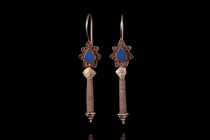 PARTHIAN GOLD PAIR OF EARRINGS

 Ca. 2nd century AD
 A pair of matched earrings, cast in gold. Each earring comprises a delicately crafted hoop tha...