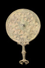 SASANIAN BRONZE MIRROR WITH HANDLE

 Ca. 500-700 AD
 A bronze mirror with a circular plate and a sturdy handle, this piece is both functional and o...