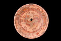 MAYAN POLYCHROME PLATE

 Ca. 600-900 AD
 A polychrome bowl featuring a circular flared rim and a shallow basin on a low foot, exuding an aura of gr...